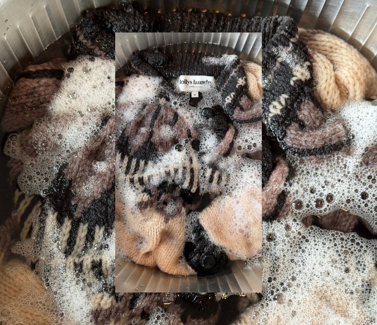 Image of a knit sweater in a basin with water and detergent.
