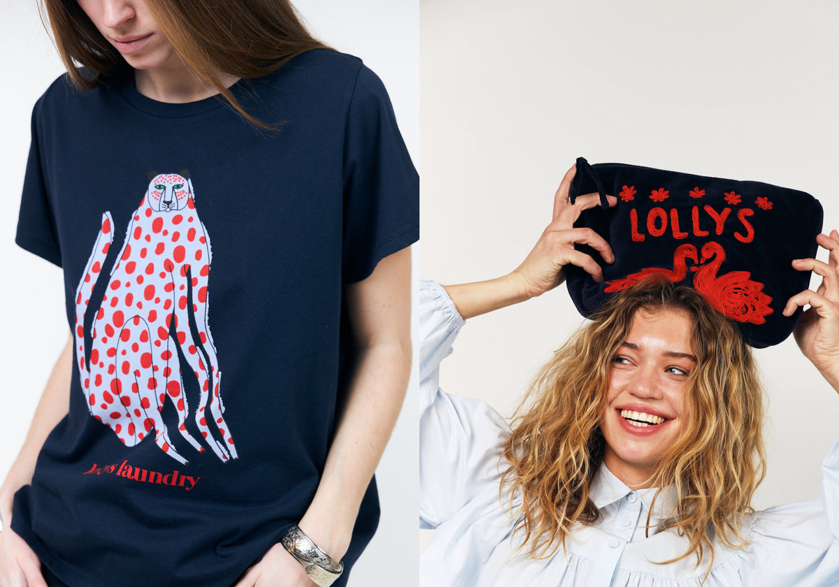 Two women showcasing colourful accessories. One wears a dark navy T-shirt with a white leopard print and red spots, while the other holds a dark navy makeup bag with red swan embroidery above her head.